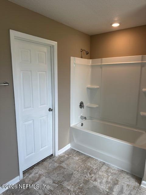 9670 Freefall Road Jacksonville, FL 32221 - Photo 20 of 31 a bathroom with a bathtub and a shower