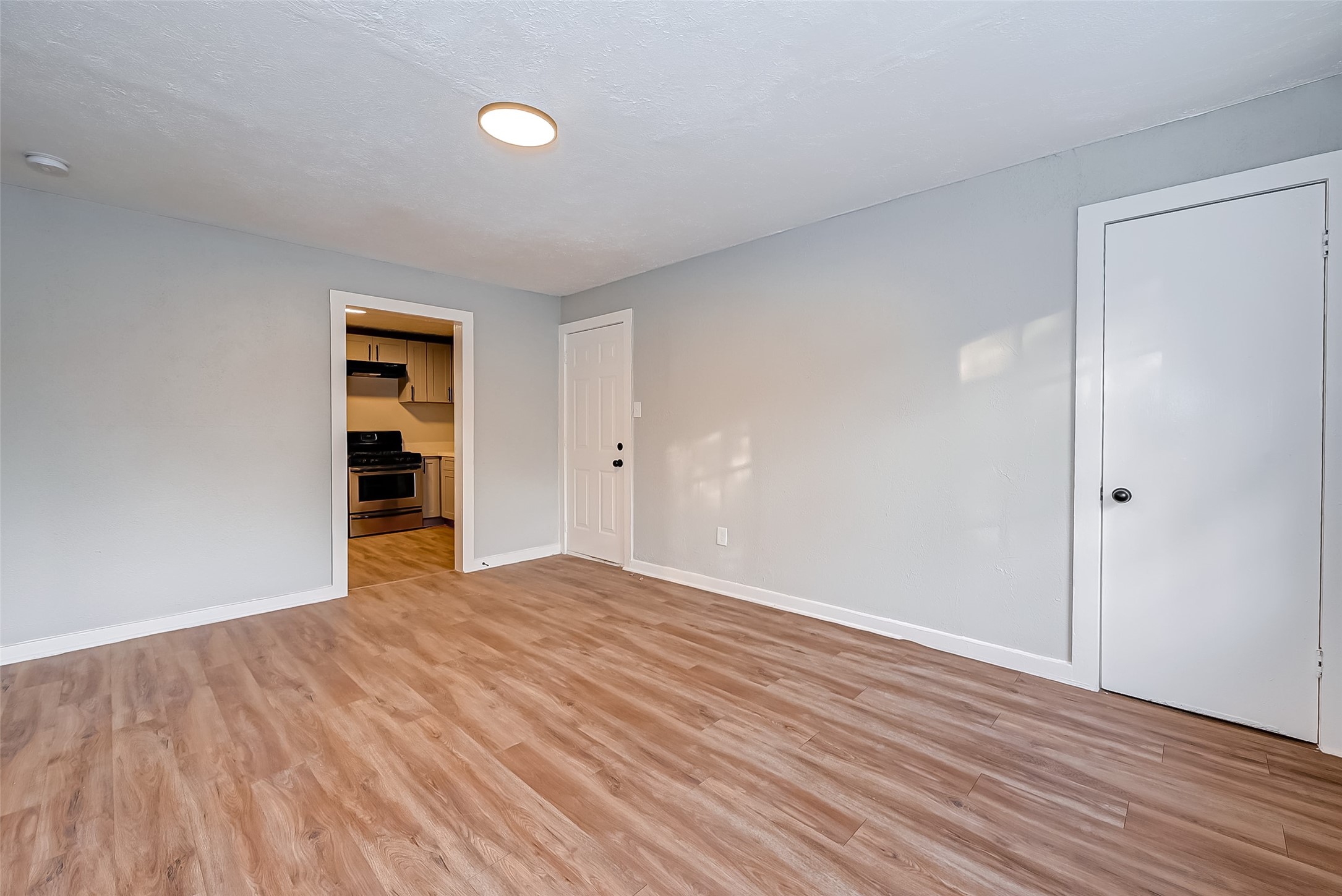6420 Conley Street, Unit 3 Houston, TX 77021 - Photo 10 of 10 an empty room with wooden floor and closet
