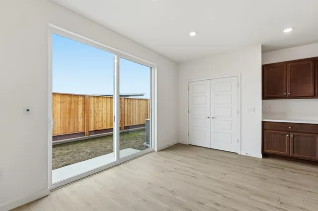 a view of entryway with wooden floor