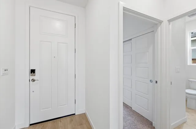 a view of an empty room with a window