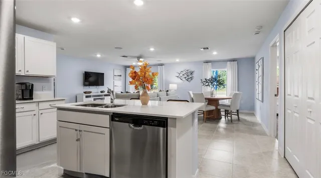 a kitchen with counter space sink appliances and cabinets