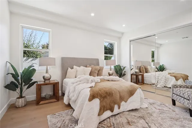 a bathroom with a toilet sink vanity and shower