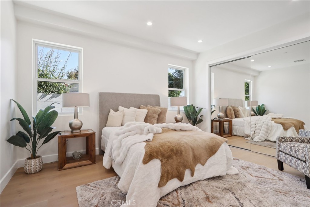 14929 Vose Street Van Nuys, CA 91405 - Photo 13 of 56 a bedroom with bed and a potted plant