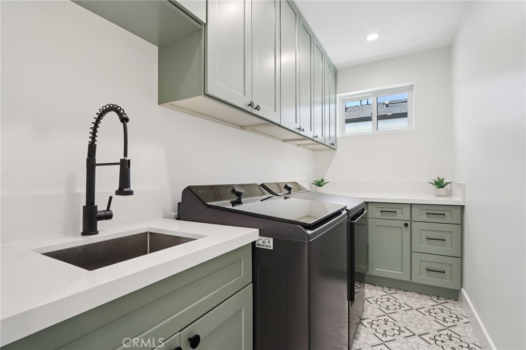 14929 Vose Street Van Nuys, CA 91405 - Photo 16 of 56 a utility room with sink dryer and washer