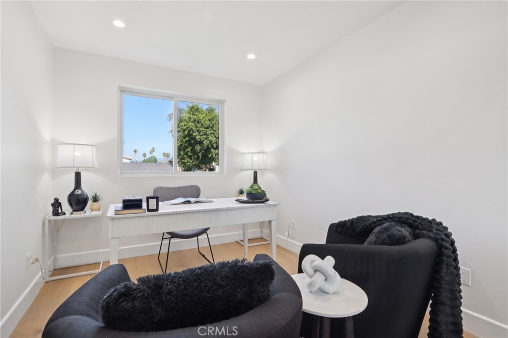 14929 Vose Street Van Nuys, CA 91405 - Photo 17 of 56 a living room with furniture and a potted plant
