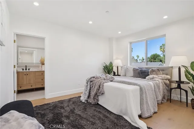 a bathroom with a double vanity sink toilet and shower