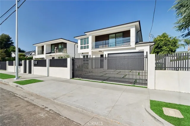 a front view of a house with garage