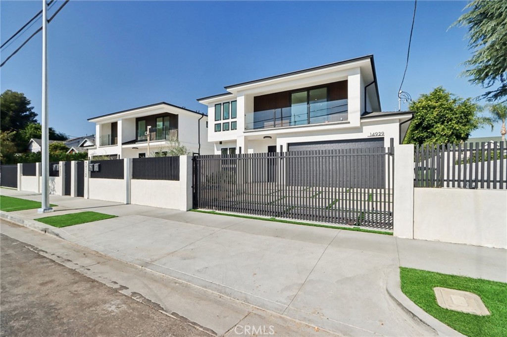 14929 Vose Street Van Nuys, CA 91405 - Photo 2 of 56 a front view of a house with garage