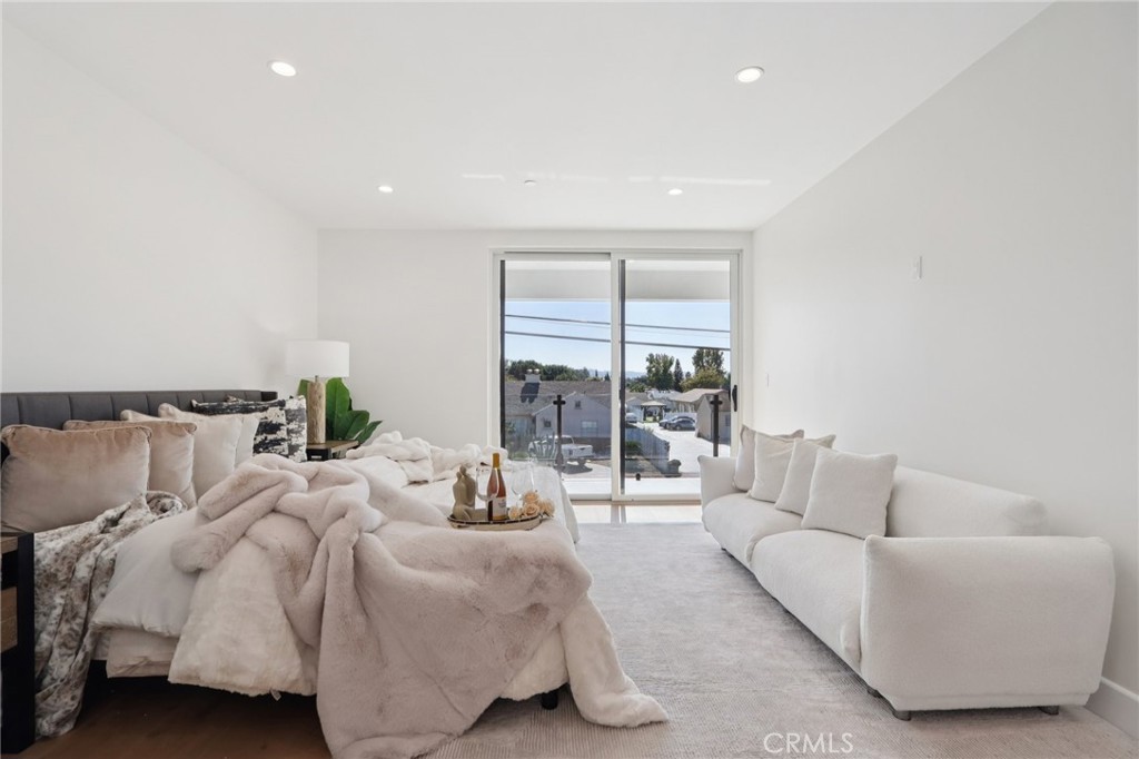14929 Vose Street Van Nuys, CA 91405 - Photo 23 of 56 a living room with furniture and a large window