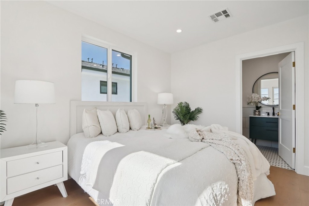 14929 Vose Street Van Nuys, CA 91405 - Photo 27 of 56 a bedroom with a bed and a window