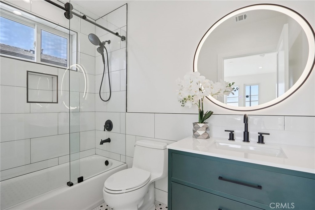 14929 Vose Street Van Nuys, CA 91405 - Photo 28 of 56 a bathroom with a sink a toilet and shower