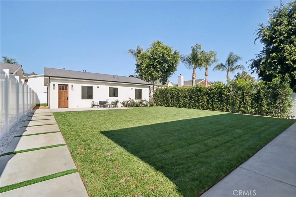 14929 Vose Street Van Nuys, CA 91405 - Photo 32 of 56 a front view of a house with a yard