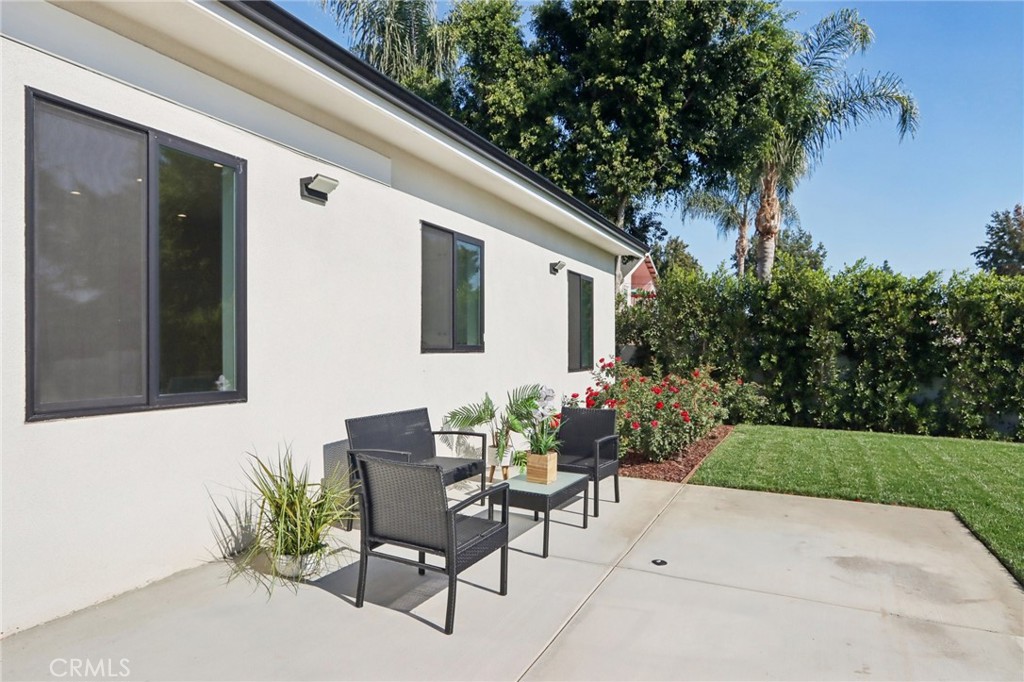 14929 Vose Street Van Nuys, CA 91405 - Photo 34 of 56 a backyard of a house with table and chairs