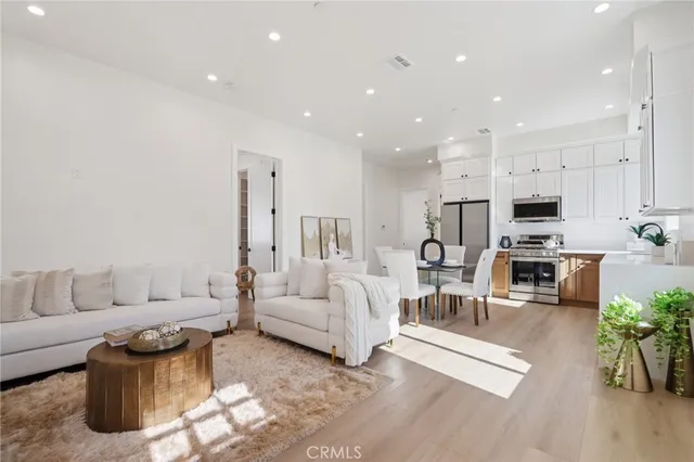 a bathroom with a sink a mirror a toilet and shower