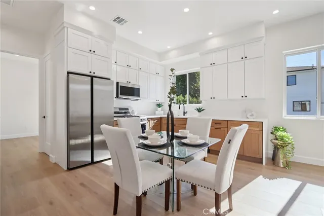 a view of a room with wooden floor and window