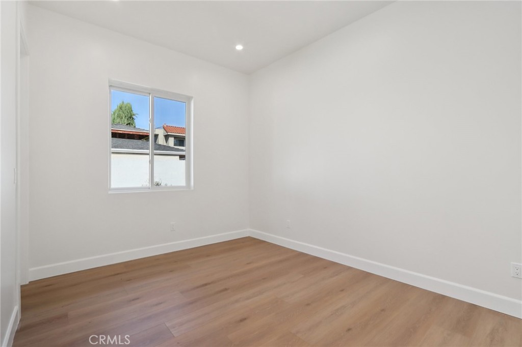 14929 Vose Street Van Nuys, CA 91405 - Photo 41 of 56 a view of a room with wooden floor and window