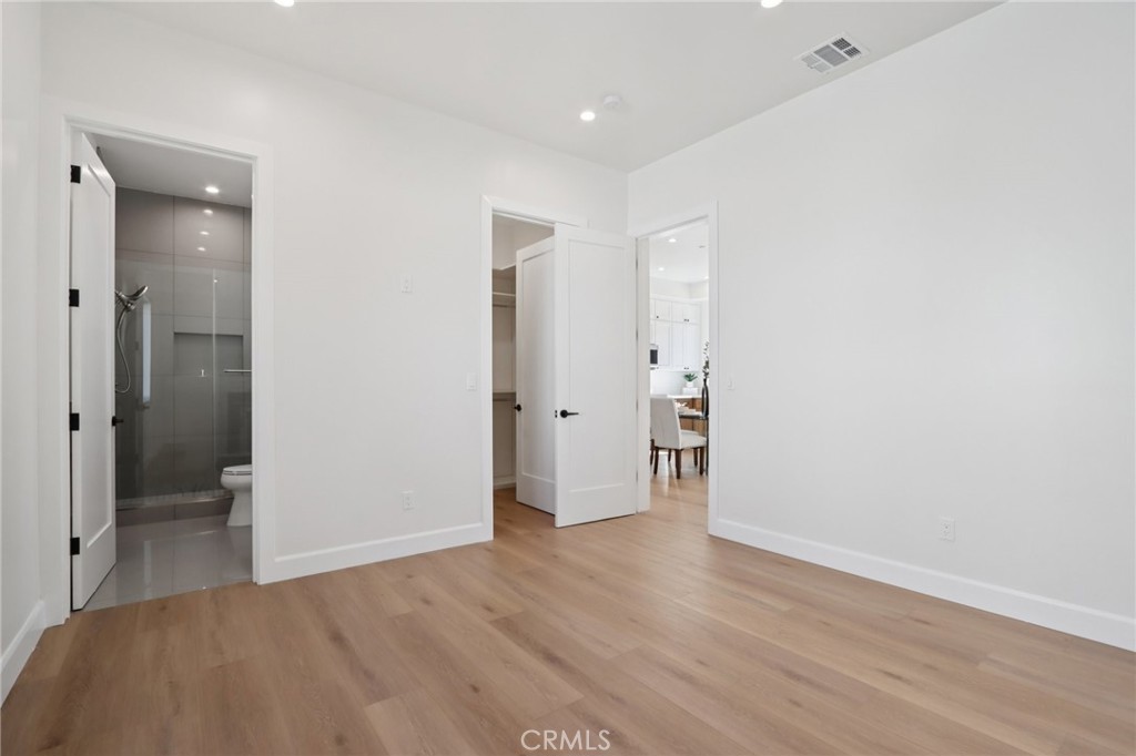 14929 Vose Street Van Nuys, CA 91405 - Photo 47 of 56 a view of a room with wooden floor and a bathroom