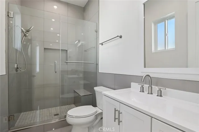 a view of a backyard with plants and patio