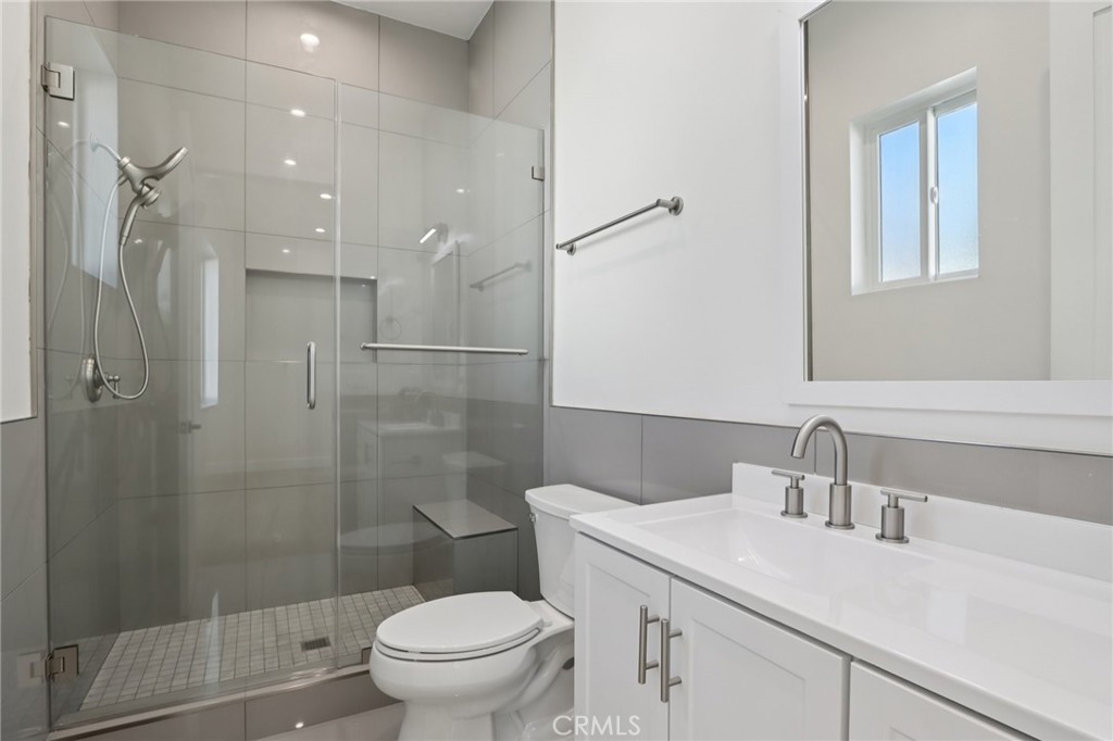 14929 Vose Street Van Nuys, CA 91405 - Photo 48 of 56 a bathroom with a sink toilet and shower