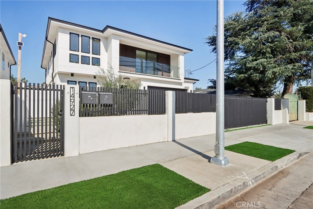 14929 Vose Street Van Nuys, CA 91405 - Photo 49 of 56 a front view of a house with a yard