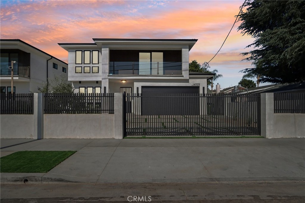 14929 Vose Street Van Nuys, CA 91405 - Photo 51 of 56 a front view of a house with garage
