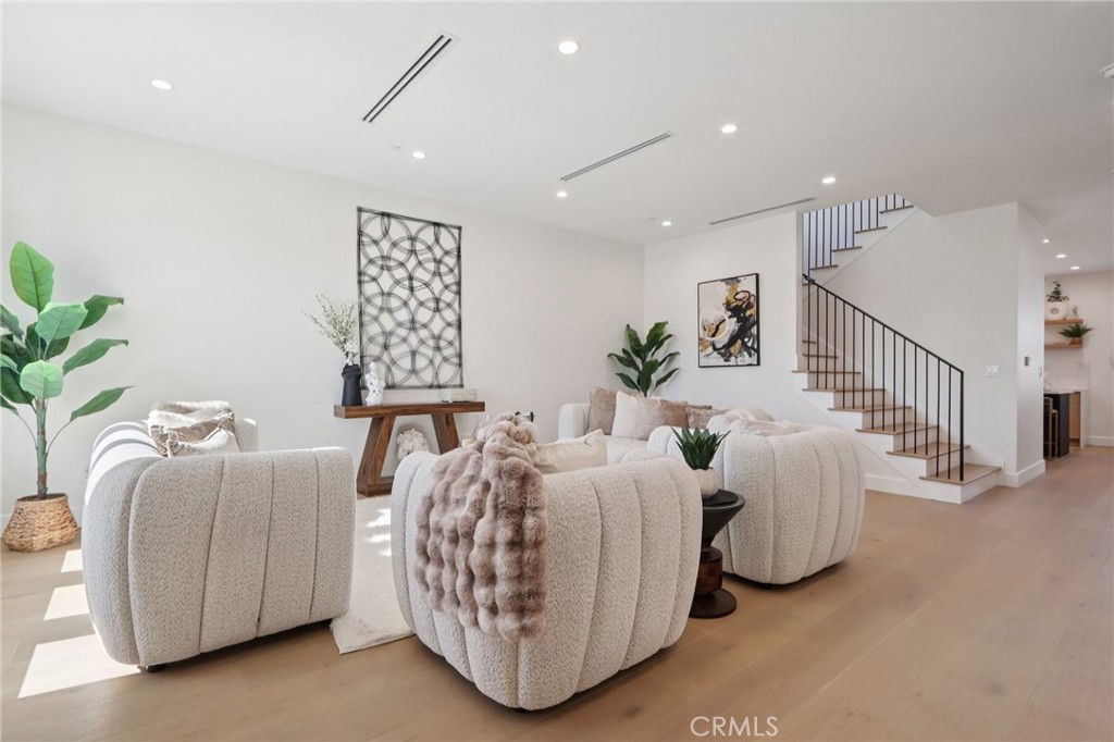 14929 Vose Street Van Nuys, CA 91405 - Photo 6 of 56 a living room with furniture and a potted plant