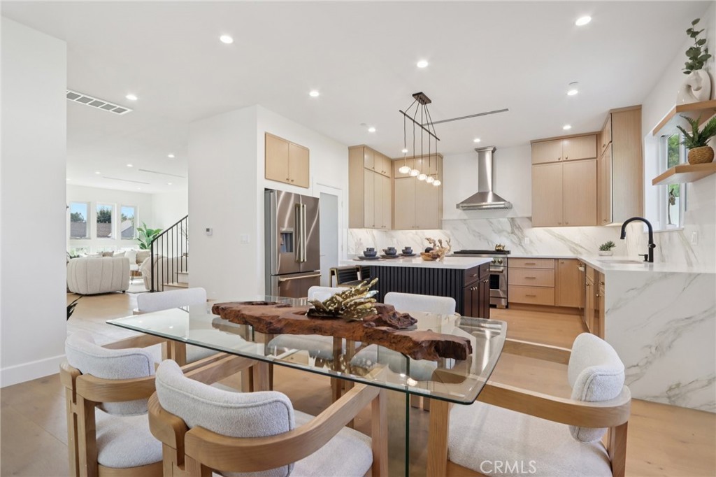 14929 Vose Street Van Nuys, CA 91405 - Photo 10 of 56 a living room with stainless steel appliances kitchen island granite countertop a kitchen view and a dining table