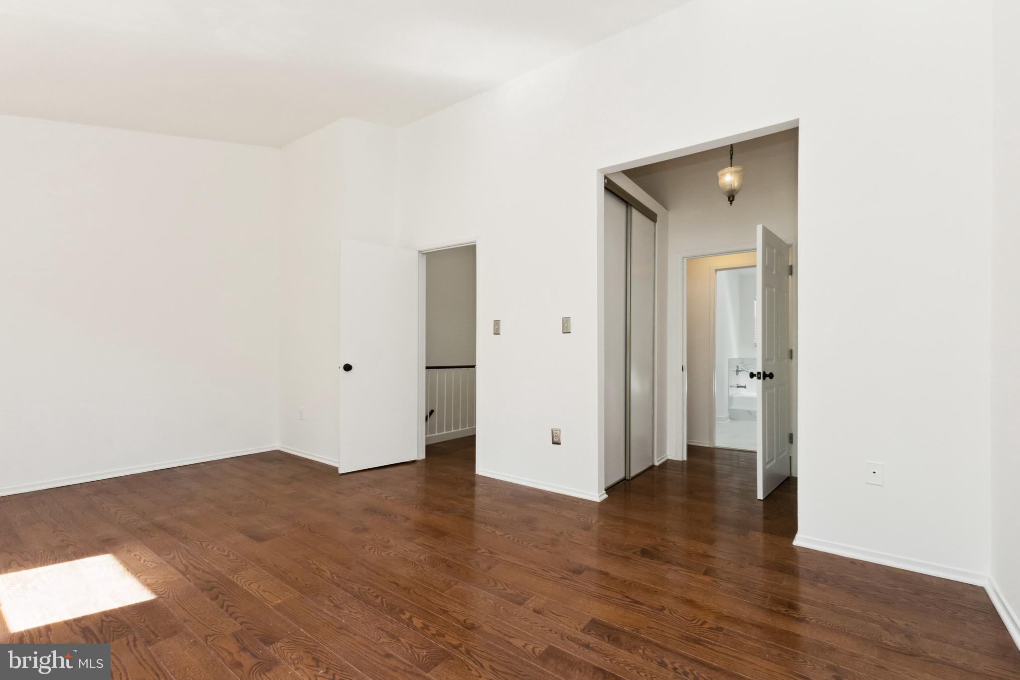 2480 Ridgehampton Court Reston, VA 20191 - Photo 14 of 25 an empty room with wooden floor and closet