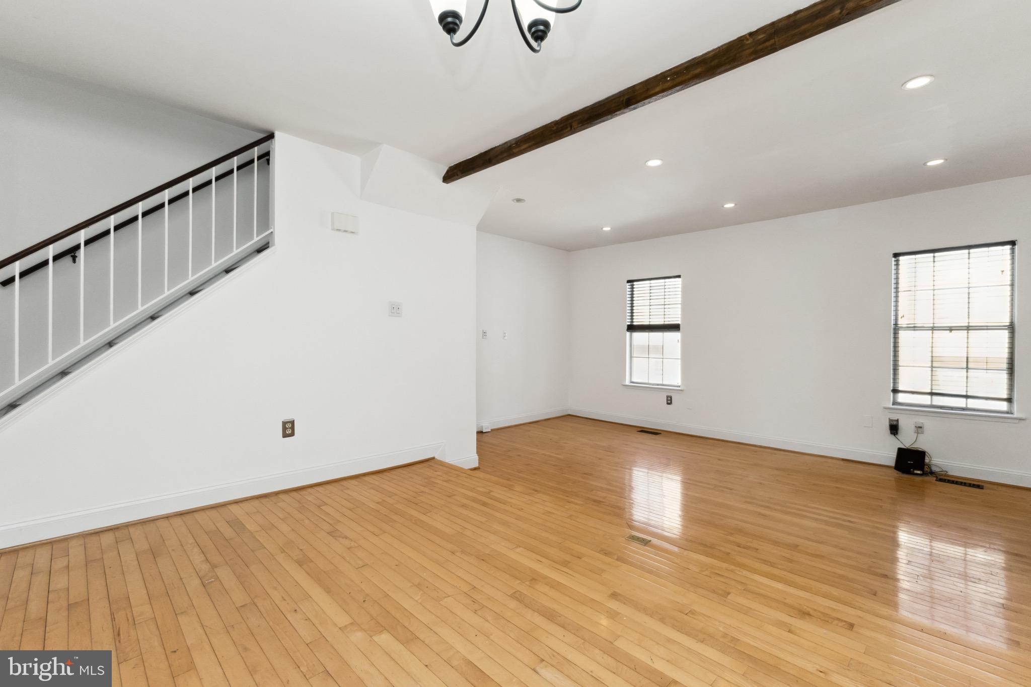 2480 Ridgehampton Court Reston, VA 20191 - Photo 3 of 25 a view of an empty room with wooden floor and a window