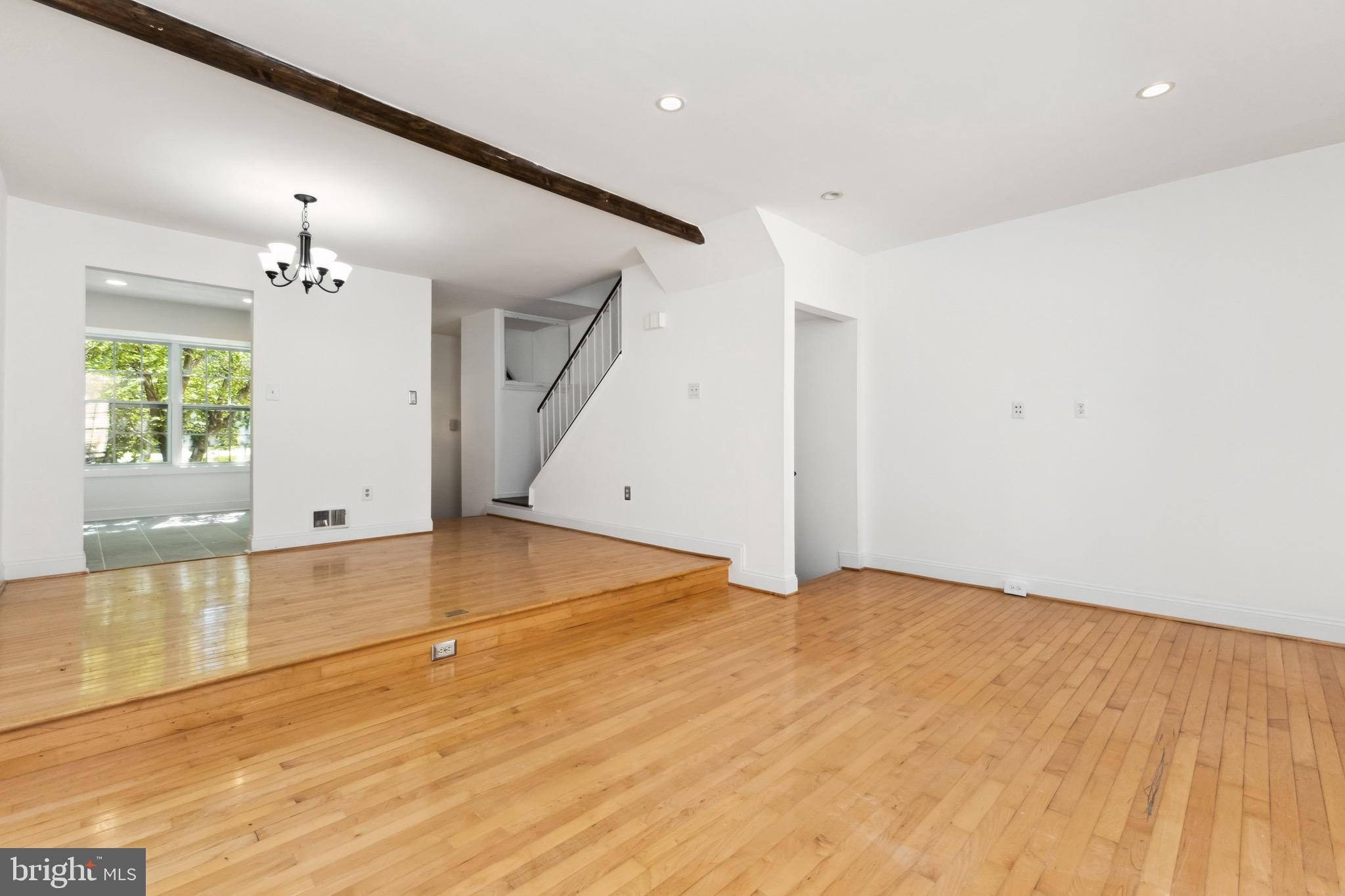 2480 Ridgehampton Court Reston, VA 20191 - Photo 5 of 25 a view of an empty room with window and wooden floor