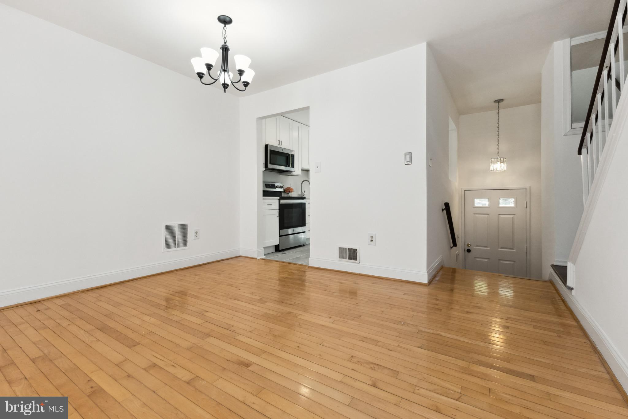 2480 Ridgehampton Court Reston, VA 20191 - Photo 6 of 25 a view of a livingroom with a chandelier
