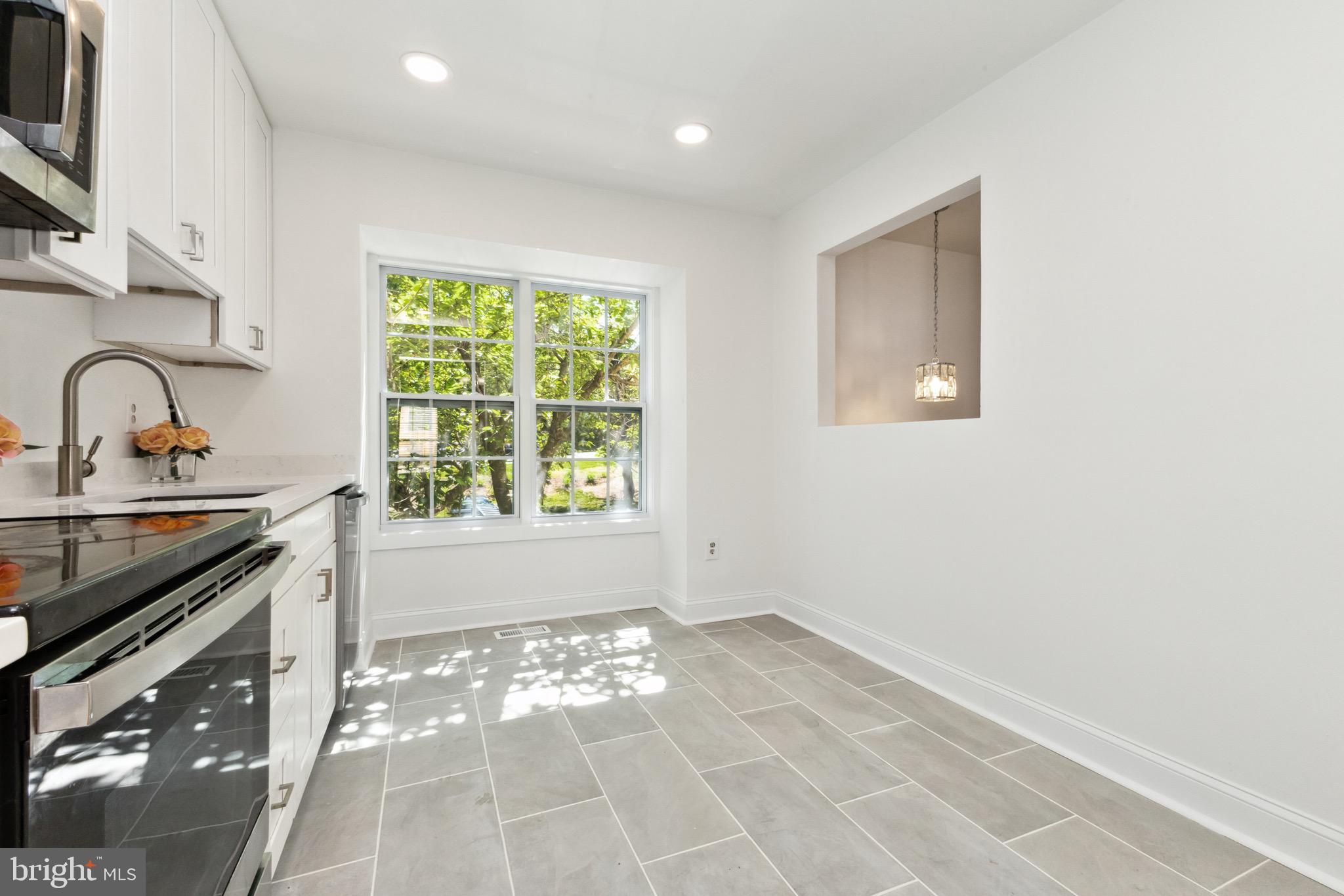 2480 Ridgehampton Court Reston, VA 20191 - Photo 8 of 25 a view of a kitchen with wooden floor and a sink