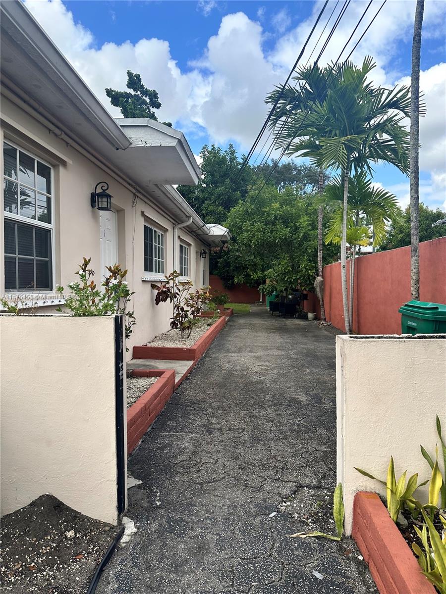 7075 Southwest 14th Street, Unit 1 Miami, FL 33144 - Photo 2 of 10 a view of a house with a patio