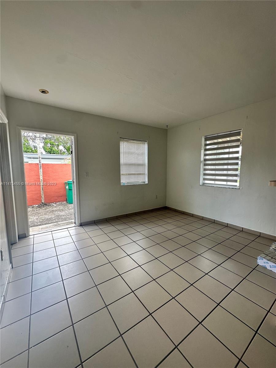7075 Southwest 14th Street, Unit 1 Miami, FL 33144 - Photo 7 of 10 a view of an empty room and window