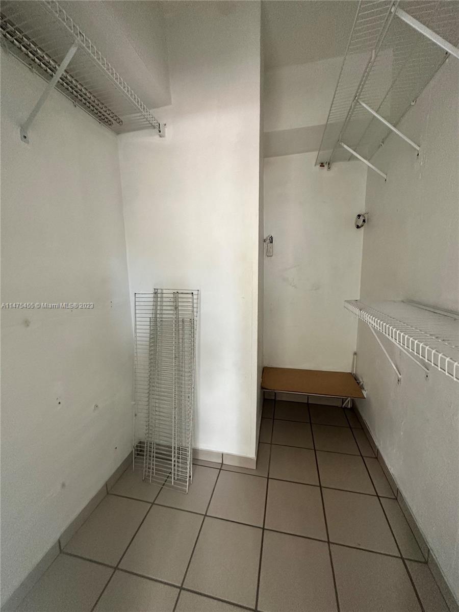 7075 Southwest 14th Street, Unit 1 Miami, FL 33144 - Photo 9 of 10 a view of an empty walk in closet