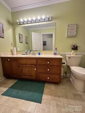 a spacious bathroom with a double vanity sink and a mirror