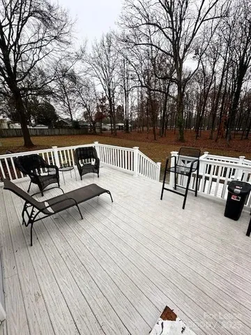 a view of wooden floor with a bench