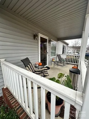 a view of balcony with furniture