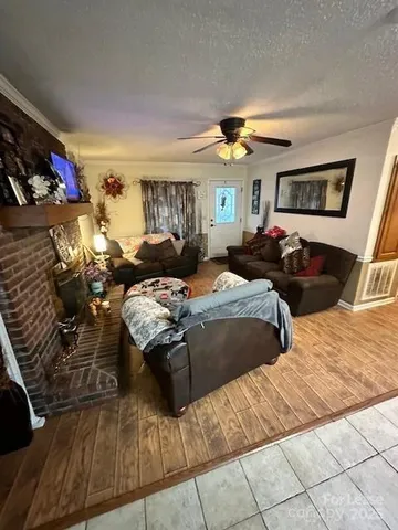 a bedroom with two beds and a lamp