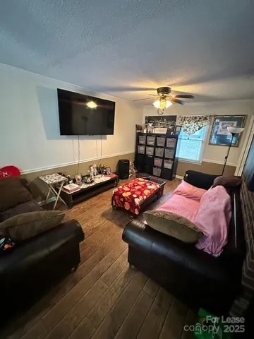 a bedroom with a bed and glass wall