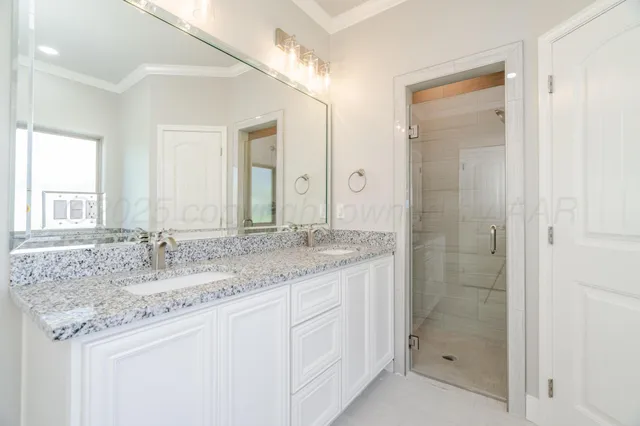 a bathroom with a bathtub and shower