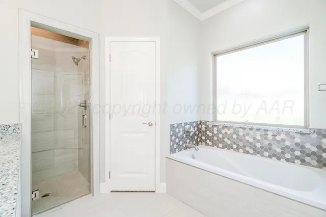 a bathroom with a granite countertop sink a mirror and a toilet