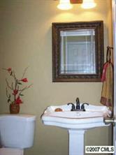 14540 Cabarrus Station Road Midland, NC 28107 - Photo 5 of 8 a bathroom with a sink and a mirror