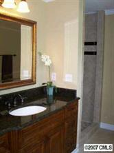 14540 Cabarrus Station Road Midland, NC 28107 - Photo 6 of 8 a bathroom with a sink and a mirror