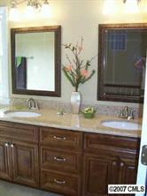 14540 Cabarrus Station Road Midland, NC 28107 - Photo 7 of 8 a bathroom with a sink and a mirror