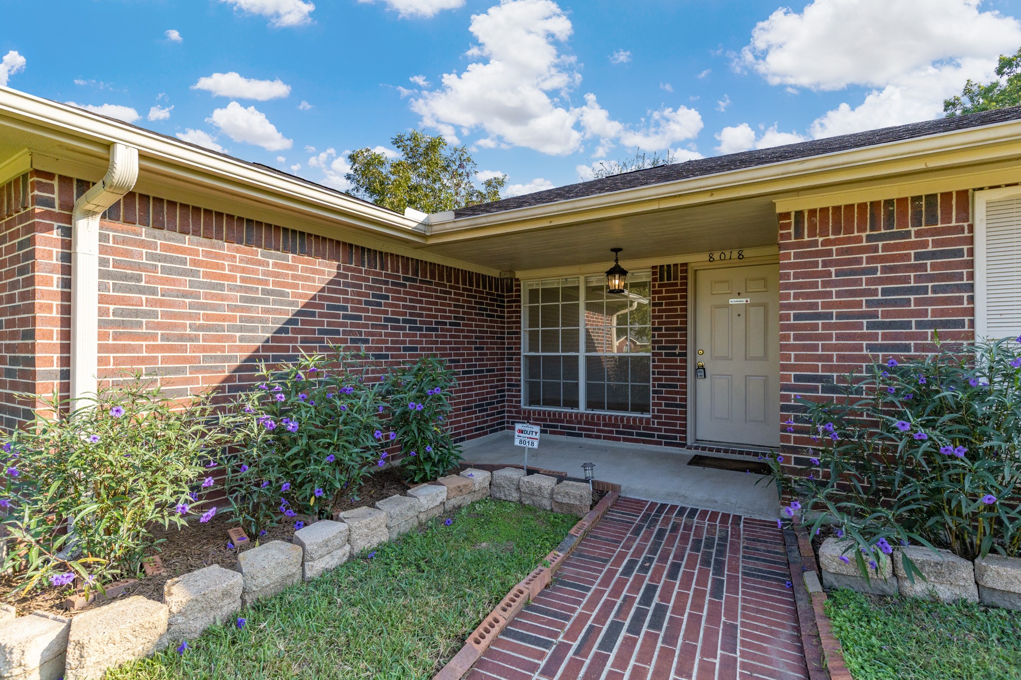 8018 Holiday Lane Houston, TX 77075 - Photo 4 of 42 a view of a porch with a bench
