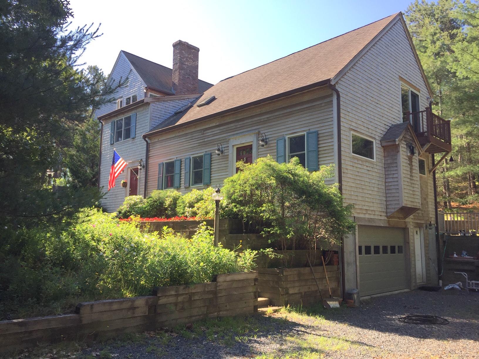 45 Marven Way Wellfleet, MA 02667 - Photo 1 of 37 a front view of a house with garden