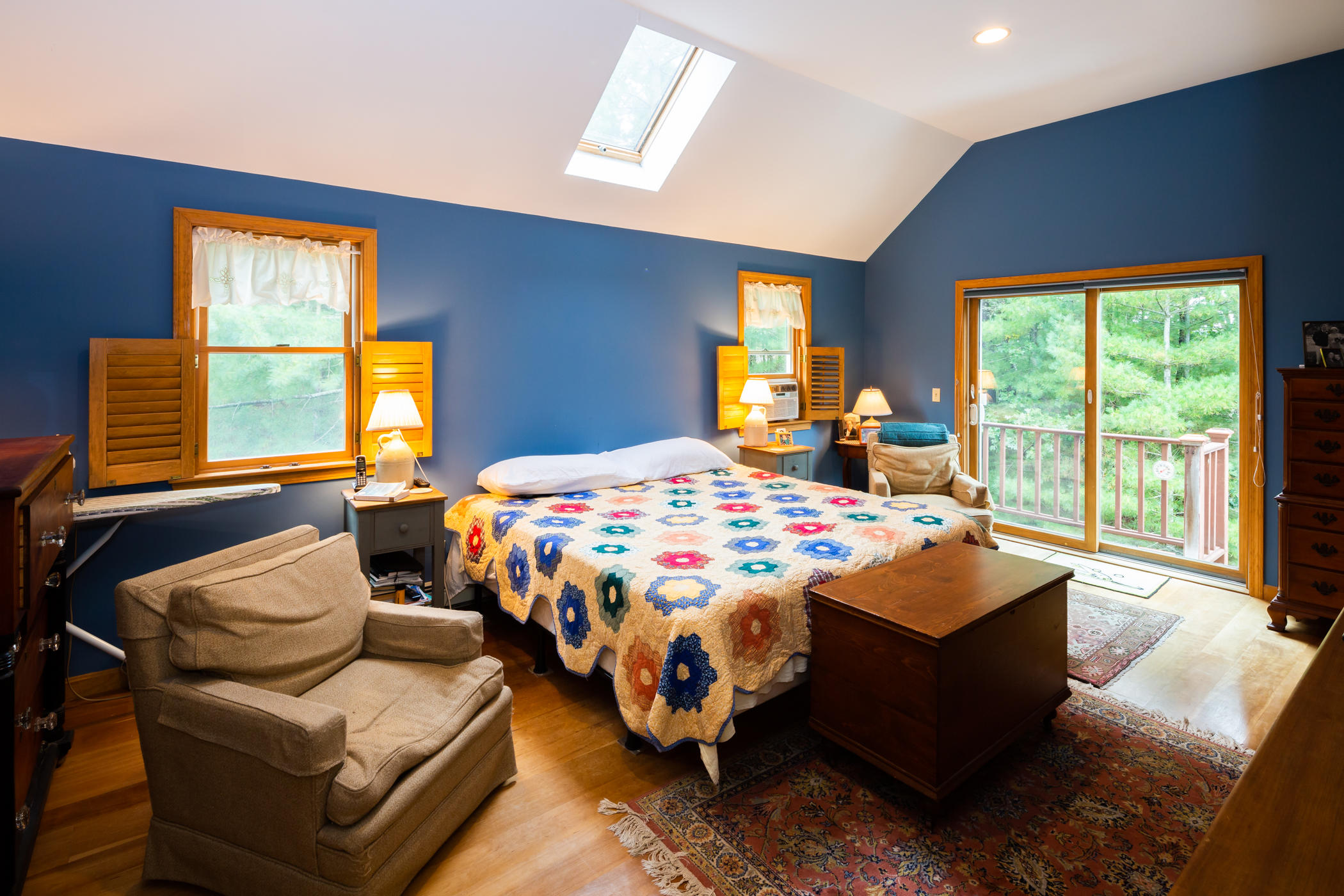 45 Marven Way Wellfleet, MA 02667 - Photo 15 of 37 a bedroom with a bed and glass windows