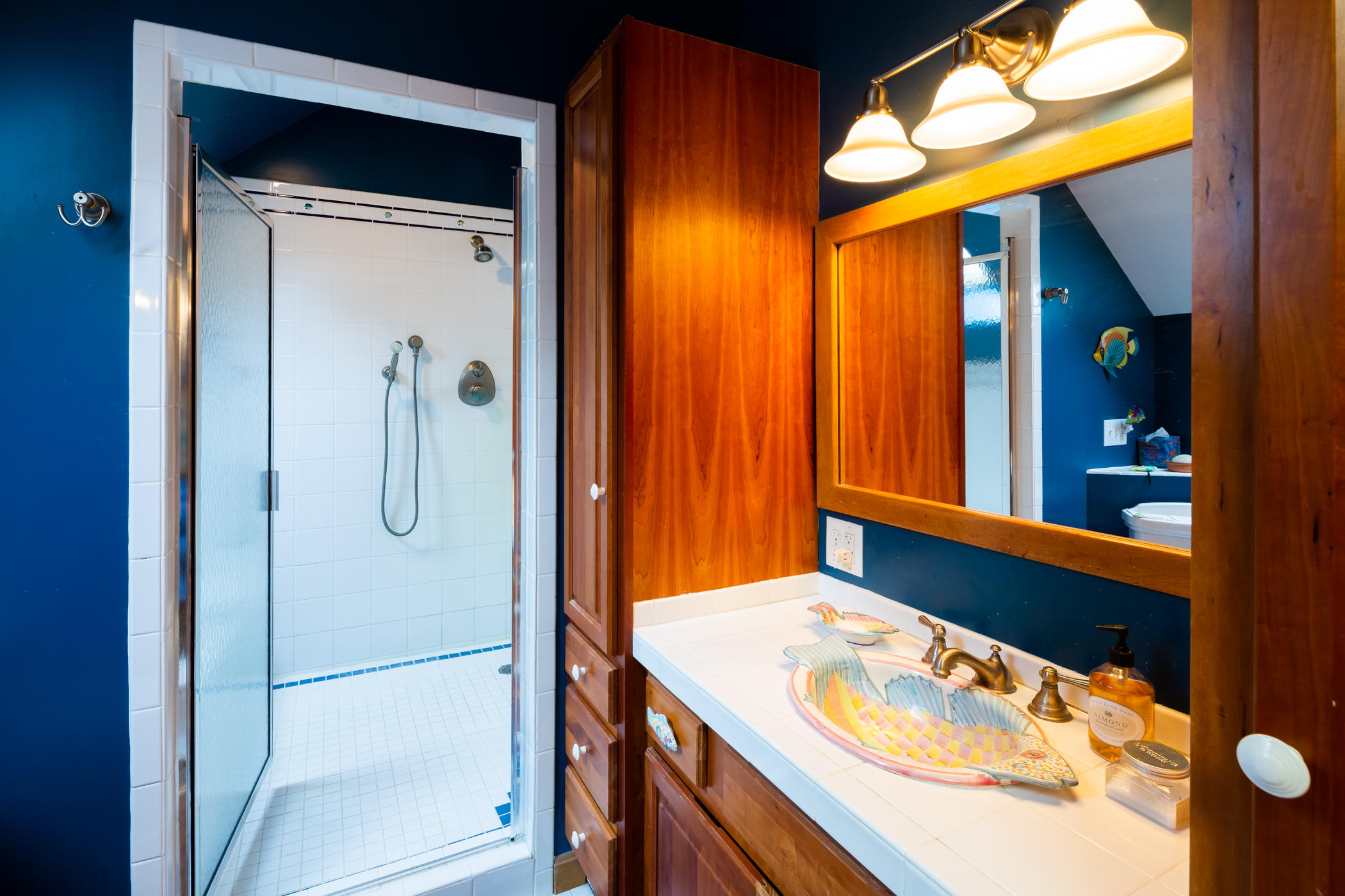 45 Marven Way Wellfleet, MA 02667 - Photo 18 of 37 a bathroom with a granite countertop sink and a mirror