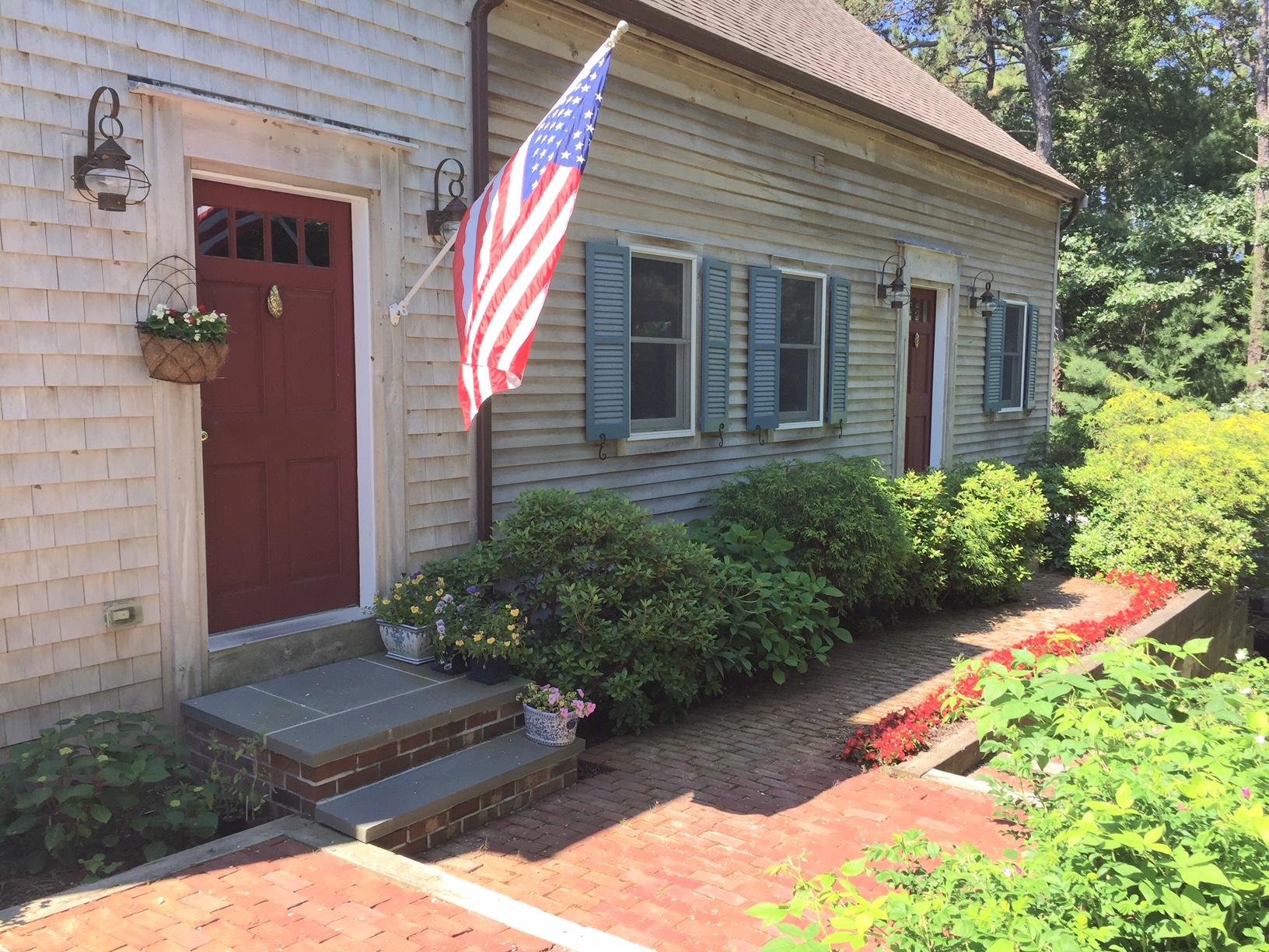 45 Marven Way Wellfleet, MA 02667 - Photo 2 of 37 a front view of a house with garden
